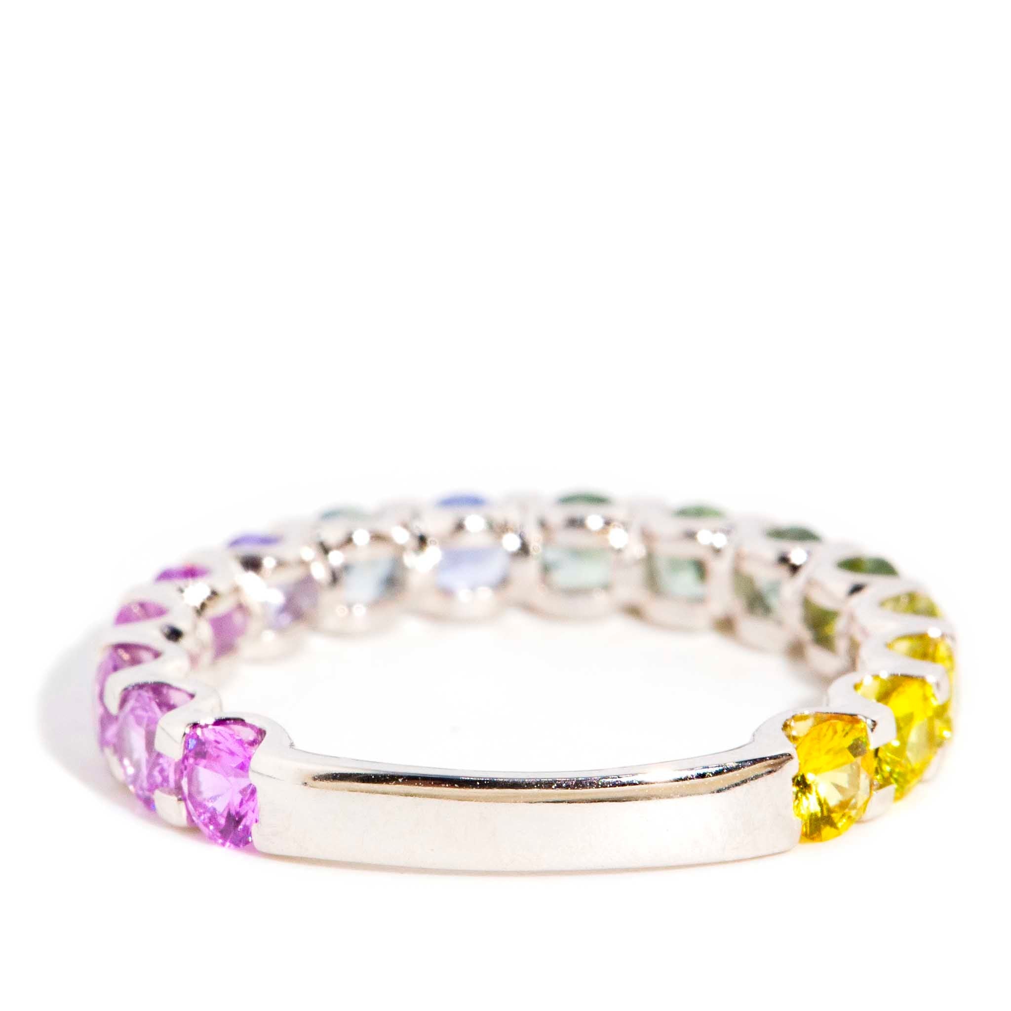 AI ALT: 18ct gold ring with Ceylon sapphire ombre in blue, pink, purple, green, and yellow hues, round faceted gemstones.