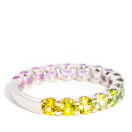 AI ALT: 18ct gold ring with ombre Ceylon sapphires in blue, pink, purple, green, and yellow, set in a sleek band design.