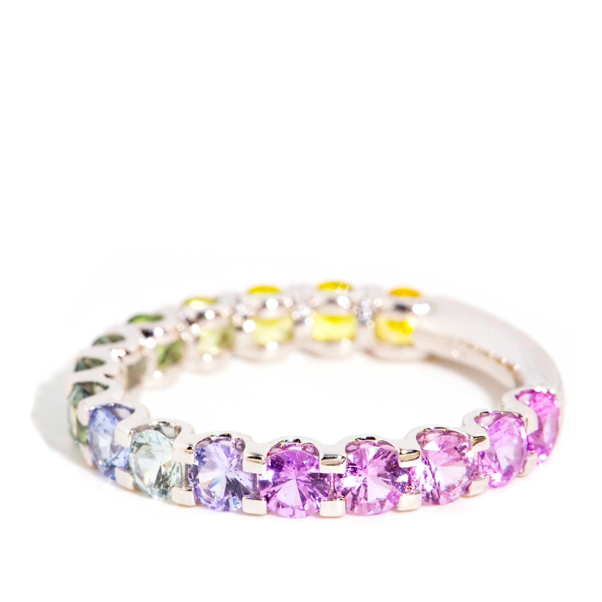 AI ALT: 18ct gold ring with ombre Ceylon sapphires in blue, pink, purple, green, yellow hues; round faceted gemstones.