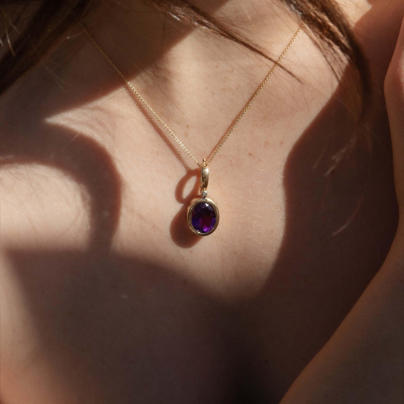 Vintage Circa 1980s Oval Amethyst Enhancer Pendant 9 Carat Gold