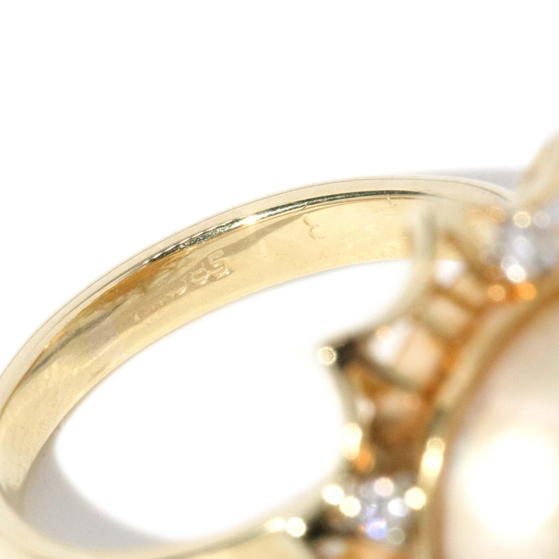 Vintage Circa 1950s Pearl and Diamond Halo Ring 14 Carat Gold