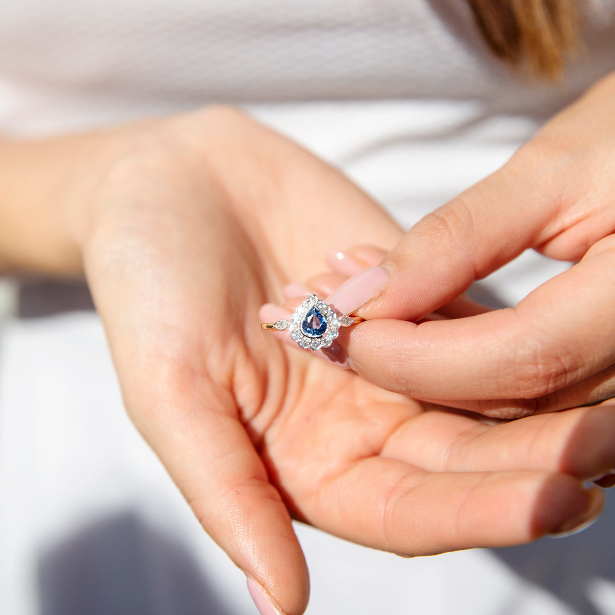 Engagement ring on sale with sapphire halo